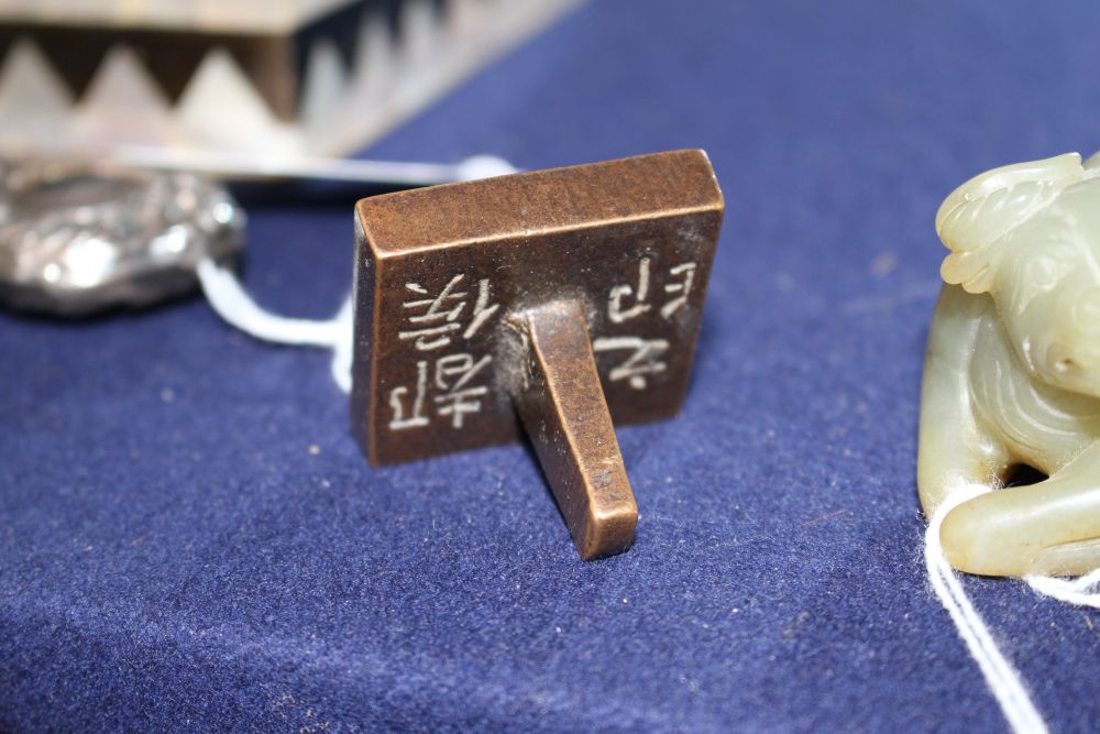 A Chinese bronze inscribed scholars seal 4cm sq.